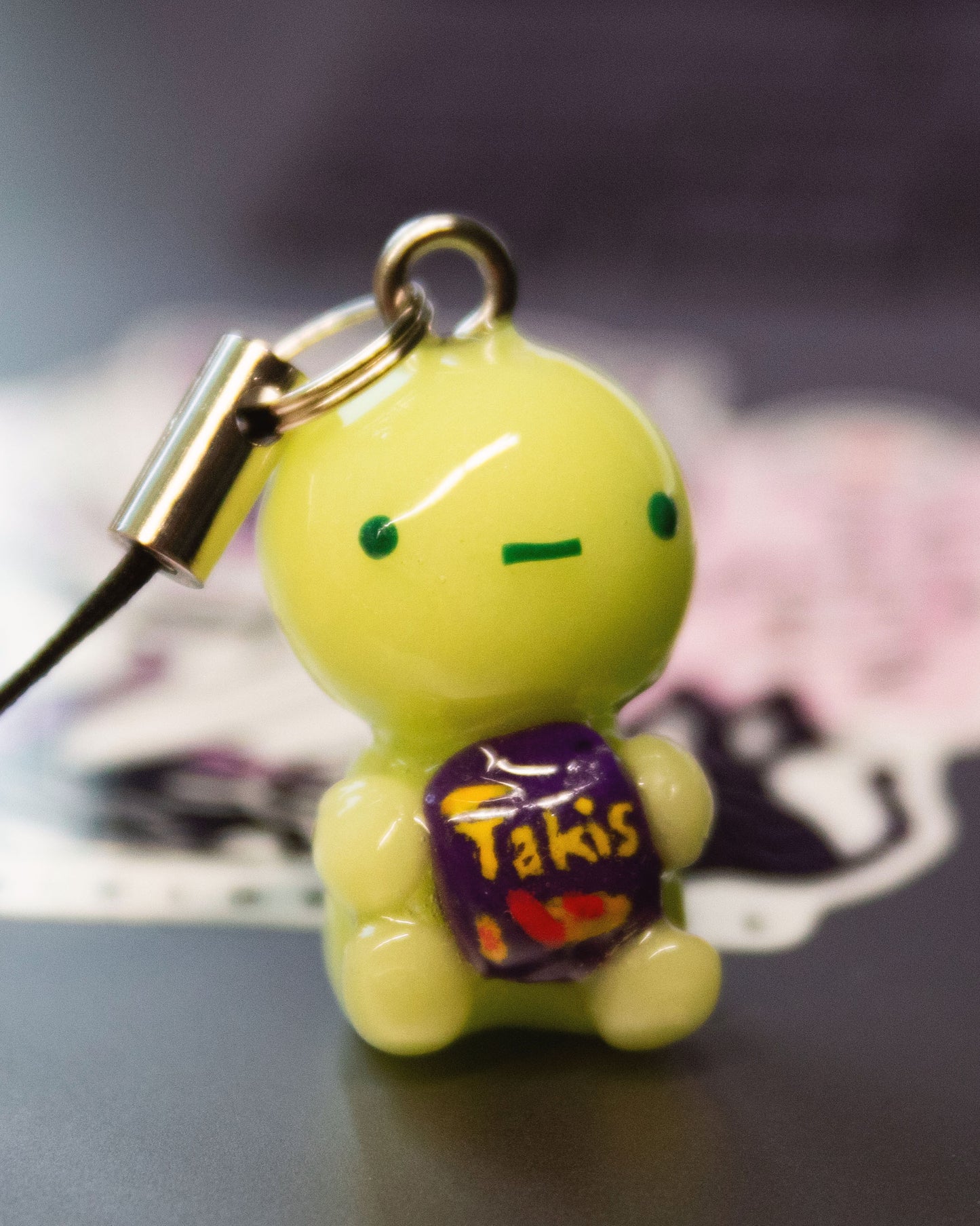 green guy with Hot Takis charm/keychain
