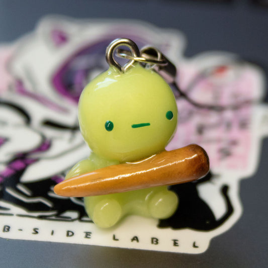 green guy with funny stick phone charm/keychain